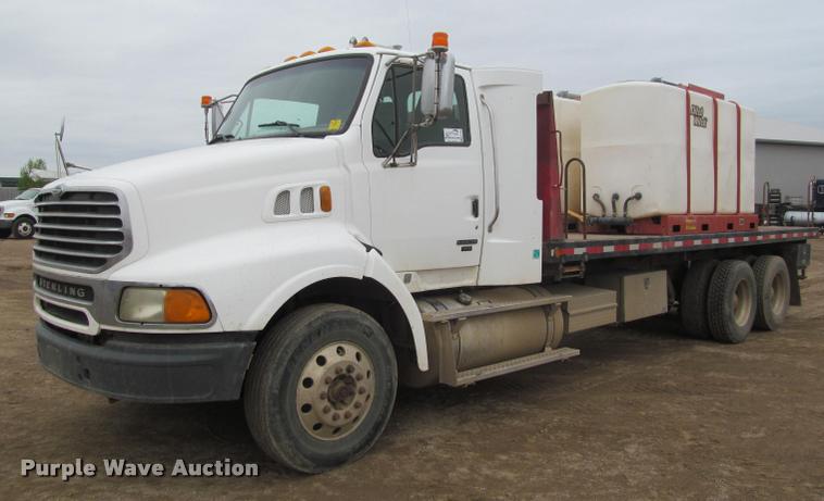 image for item DA1059 2006 Sterling A9500 flatbed truck with Ditch Witch mud mixing system