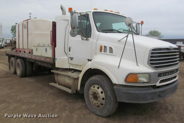 image for item DA1059 2006 Sterling A9500 flatbed truck with Ditch Witch mud mixing system