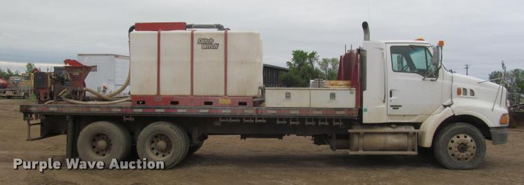 image for item DA1059 2006 Sterling A9500 flatbed truck with Ditch Witch mud mixing system