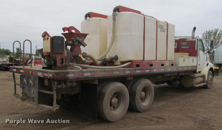 image for item DA1059 2006 Sterling A9500 flatbed truck with Ditch Witch mud mixing system