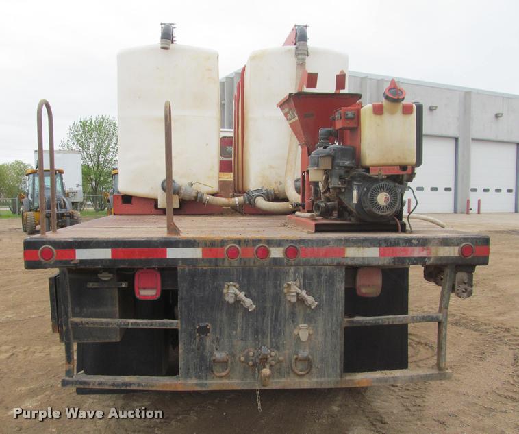 image for item DA1059 2006 Sterling A9500 flatbed truck with Ditch Witch mud mixing system