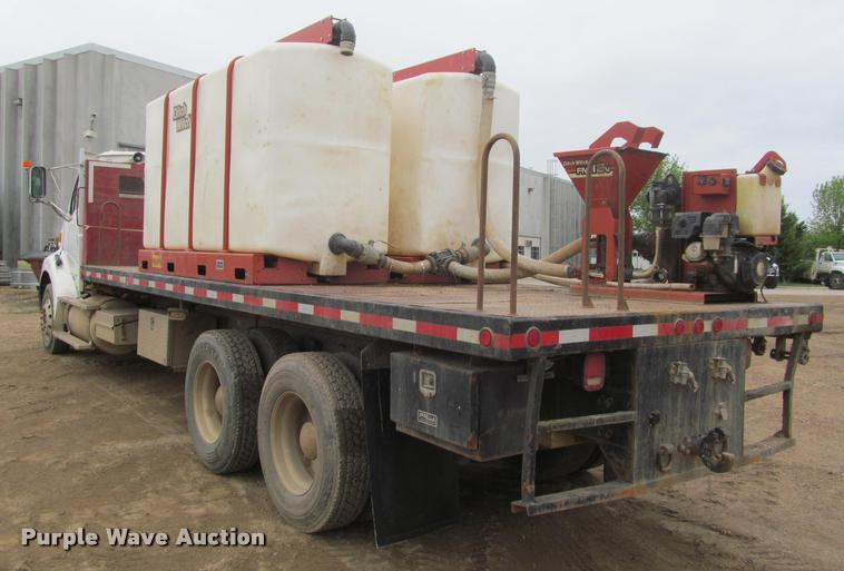 image for item DA1059 2006 Sterling A9500 flatbed truck with Ditch Witch mud mixing system