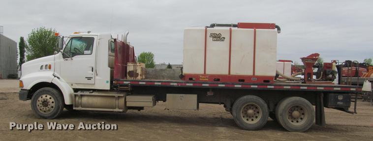 image for item DA1059 2006 Sterling A9500 flatbed truck with Ditch Witch mud mixing system
