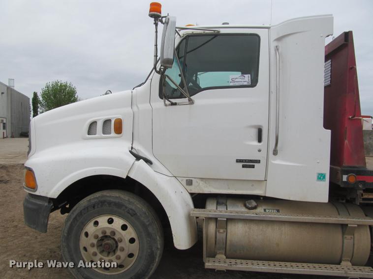 image for item DA1059 2006 Sterling A9500 flatbed truck with Ditch Witch mud mixing system