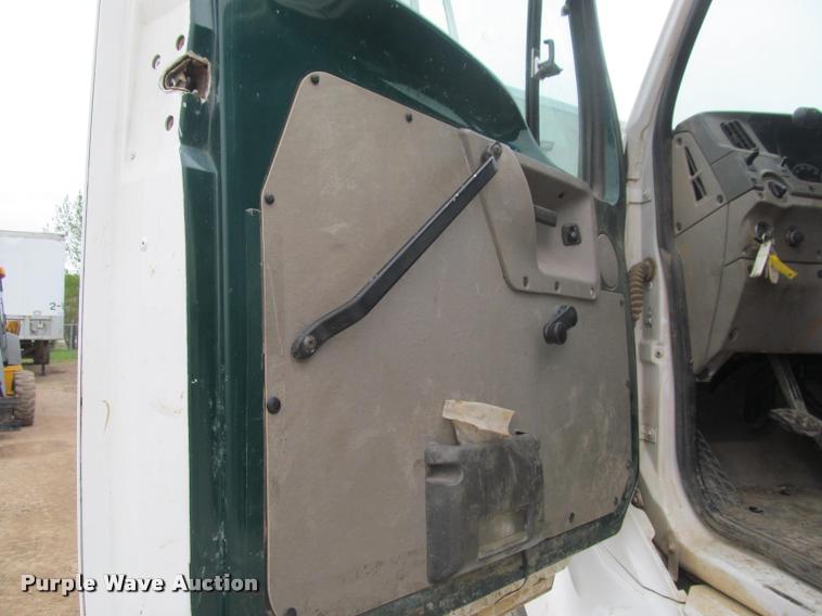 image for item DA1059 2006 Sterling A9500 flatbed truck with Ditch Witch mud mixing system