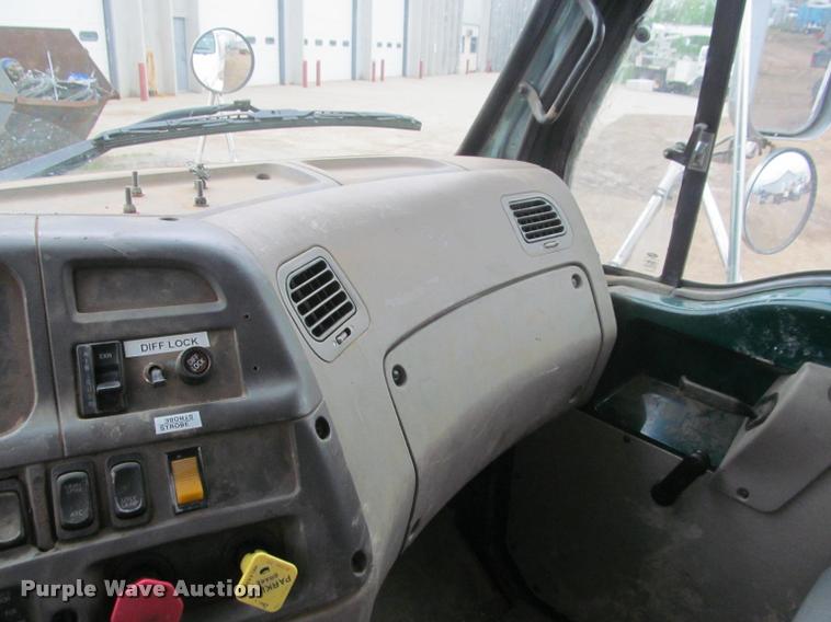 image for item DA1059 2006 Sterling A9500 flatbed truck with Ditch Witch mud mixing system