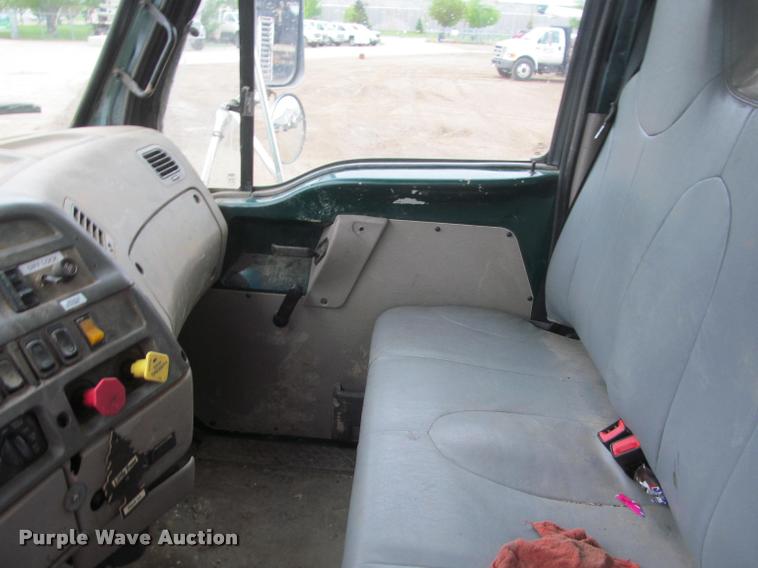 image for item DA1059 2006 Sterling A9500 flatbed truck with Ditch Witch mud mixing system