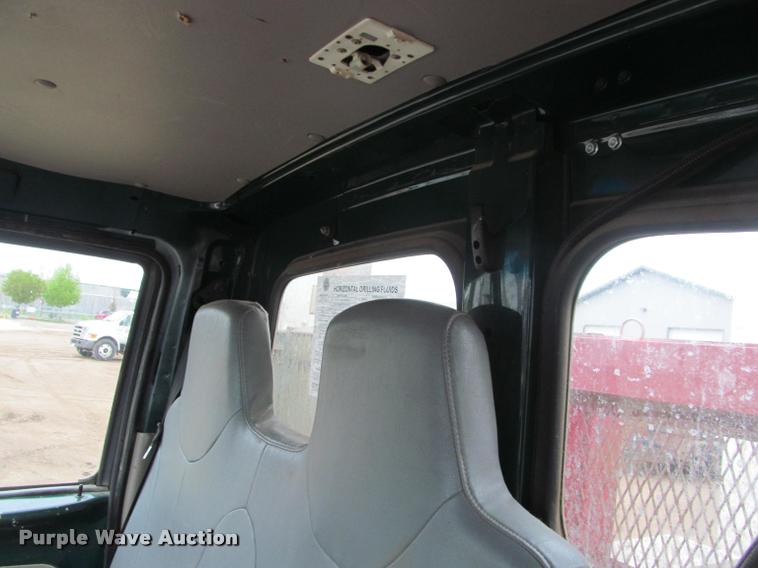 image for item DA1059 2006 Sterling A9500 flatbed truck with Ditch Witch mud mixing system