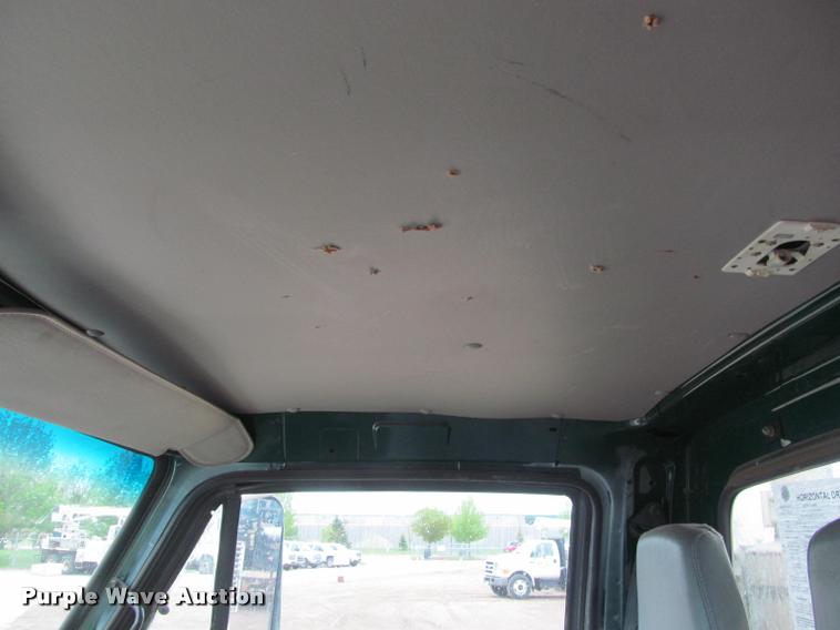 image for item DA1059 2006 Sterling A9500 flatbed truck with Ditch Witch mud mixing system