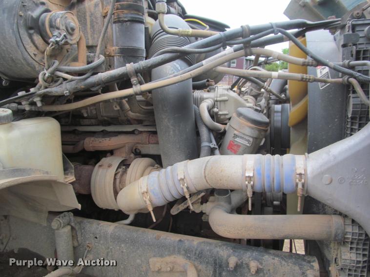 image for item DA1059 2006 Sterling A9500 flatbed truck with Ditch Witch mud mixing system