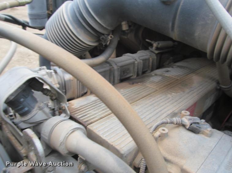 image for item DA1059 2006 Sterling A9500 flatbed truck with Ditch Witch mud mixing system