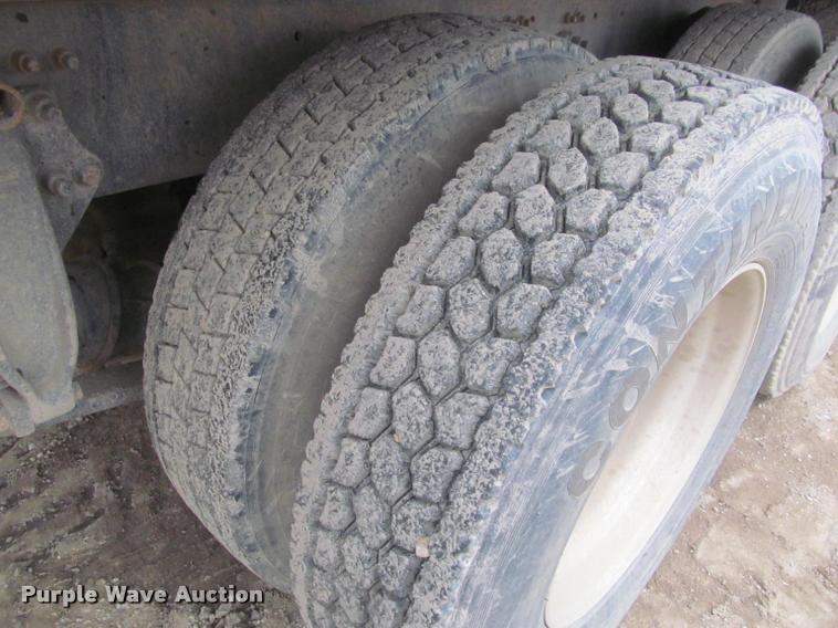 image for item DA1059 2006 Sterling A9500 flatbed truck with Ditch Witch mud mixing system