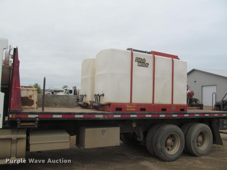 image for item DA1059 2006 Sterling A9500 flatbed truck with Ditch Witch mud mixing system