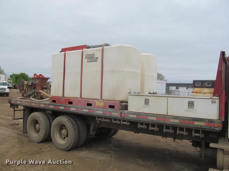image for item DA1059 2006 Sterling A9500 flatbed truck with Ditch Witch mud mixing system