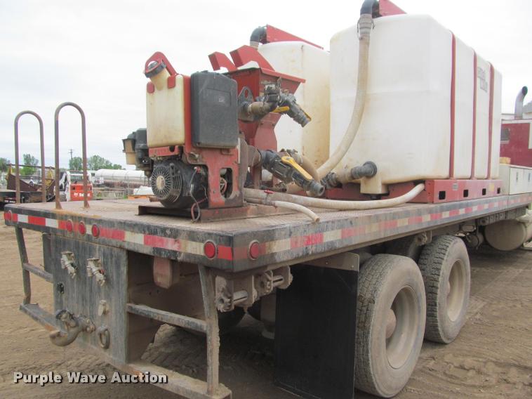 image for item DA1059 2006 Sterling A9500 flatbed truck with Ditch Witch mud mixing system
