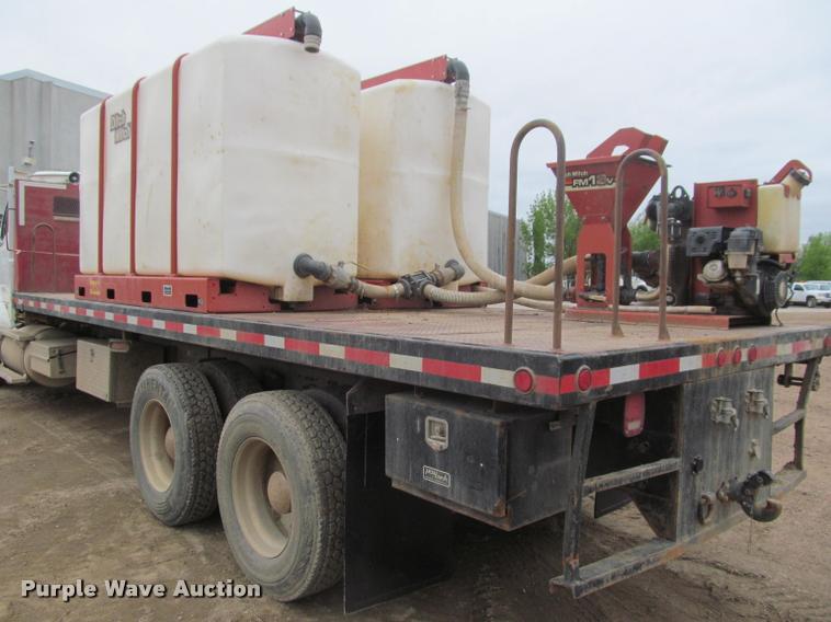 image for item DA1059 2006 Sterling A9500 flatbed truck with Ditch Witch mud mixing system