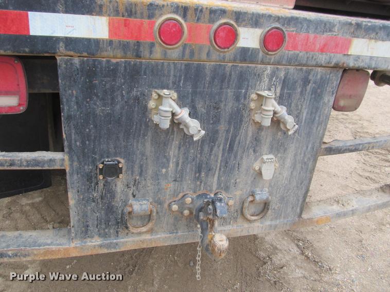 image for item DA1059 2006 Sterling A9500 flatbed truck with Ditch Witch mud mixing system