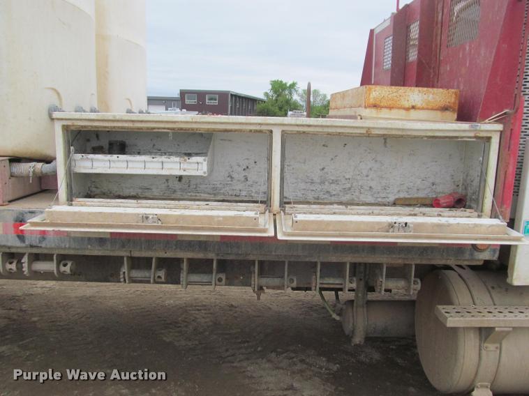 image for item DA1059 2006 Sterling A9500 flatbed truck with Ditch Witch mud mixing system