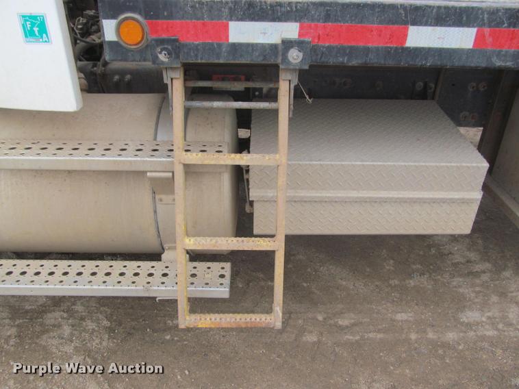 image for item DA1059 2006 Sterling A9500 flatbed truck with Ditch Witch mud mixing system