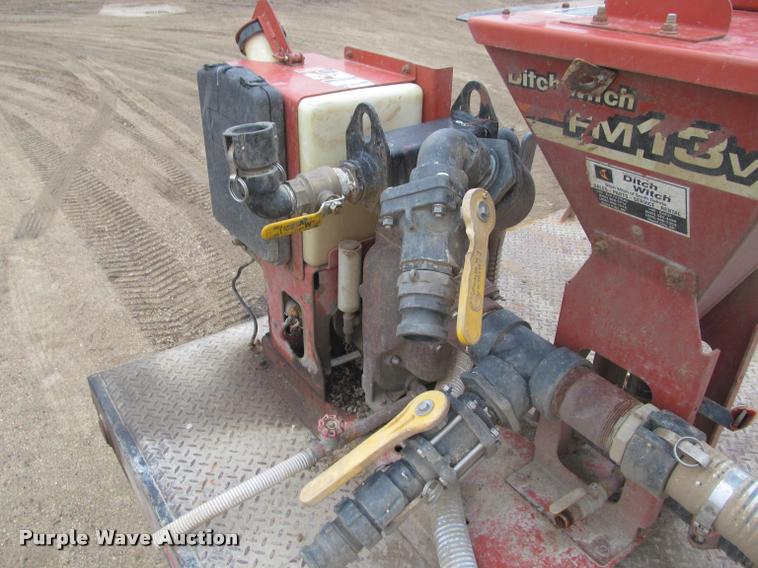 image for item DA1059 2006 Sterling A9500 flatbed truck with Ditch Witch mud mixing system