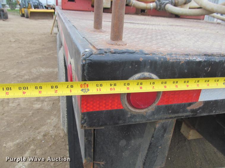 image for item DA1059 2006 Sterling A9500 flatbed truck with Ditch Witch mud mixing system