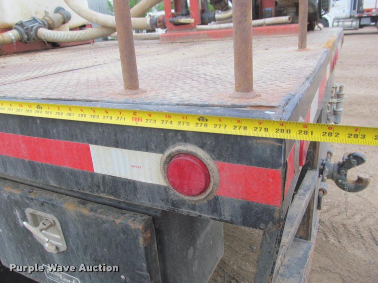 image for item DA1059 2006 Sterling A9500 flatbed truck with Ditch Witch mud mixing system