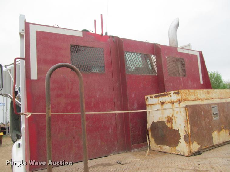 image for item DA1059 2006 Sterling A9500 flatbed truck with Ditch Witch mud mixing system