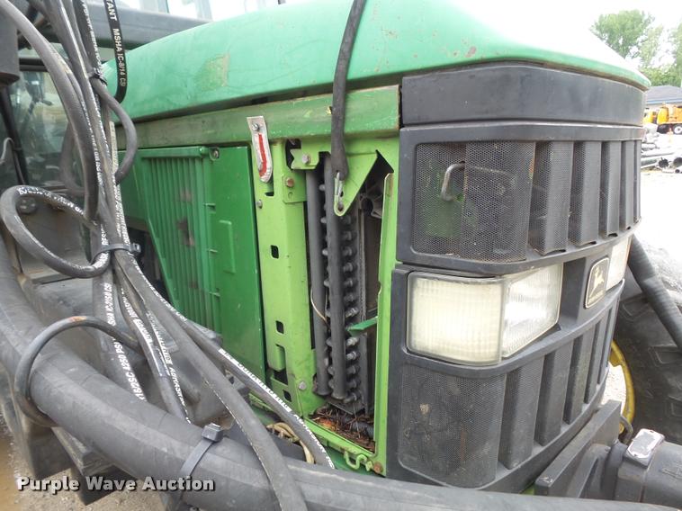 image for item K7637 1999 John Deere 6410 MFWD tractor