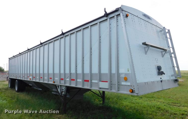 image for item DB1011 2000 Corn Husker triple hopper bottom grain trailer