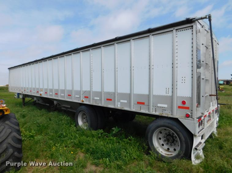 image for item DB1011 2000 Corn Husker triple hopper bottom grain trailer