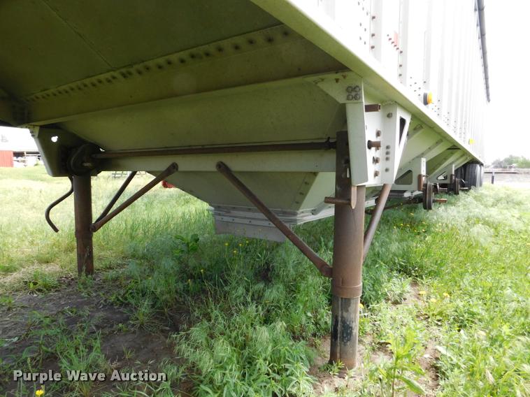 image for item DB1011 2000 Corn Husker triple hopper bottom grain trailer