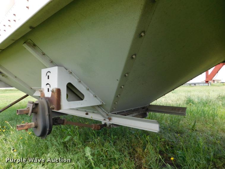 image for item DB1011 2000 Corn Husker triple hopper bottom grain trailer