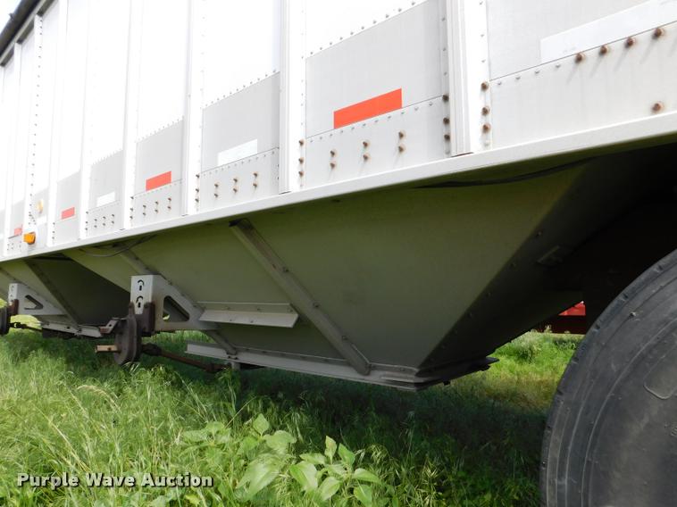 image for item DB1011 2000 Corn Husker triple hopper bottom grain trailer