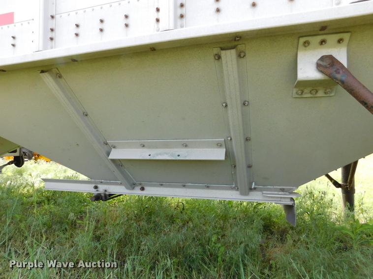 image for item DB1011 2000 Corn Husker triple hopper bottom grain trailer