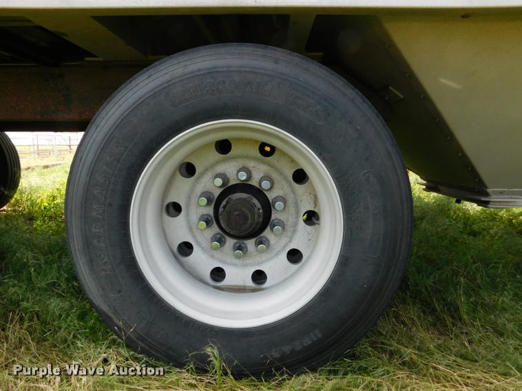 image for item DB1011 2000 Corn Husker triple hopper bottom grain trailer