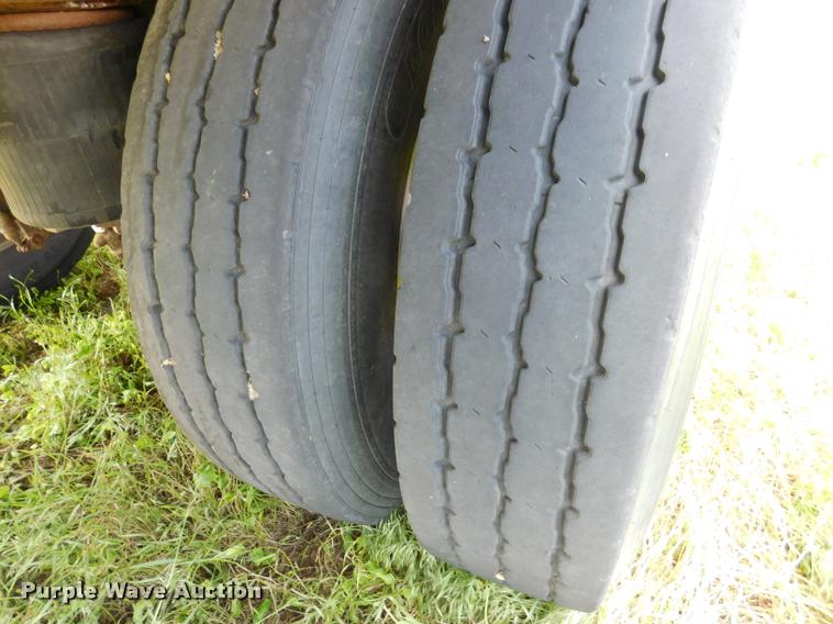 image for item DB1011 2000 Corn Husker triple hopper bottom grain trailer