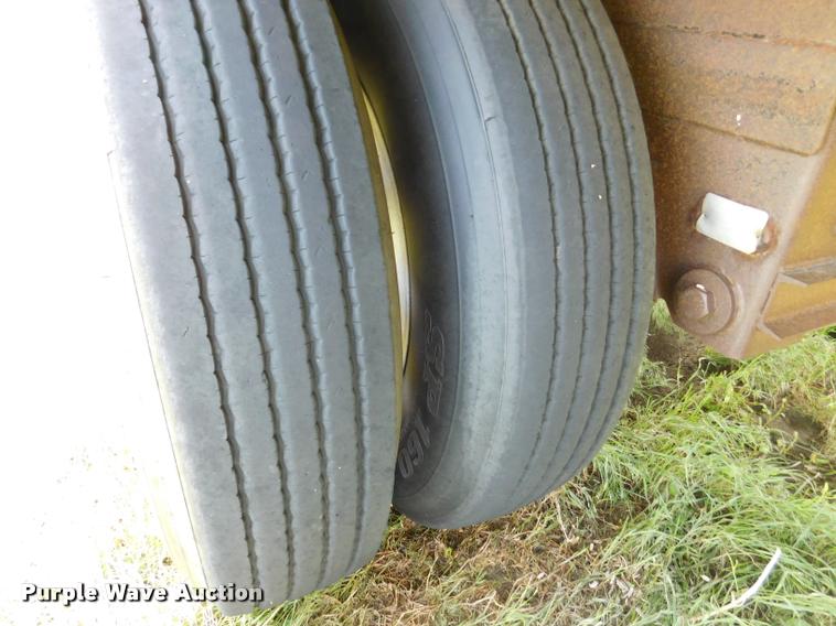 image for item DB1011 2000 Corn Husker triple hopper bottom grain trailer
