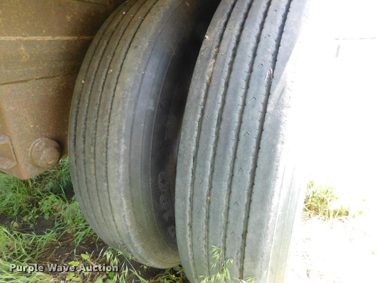 image for item DB1011 2000 Corn Husker triple hopper bottom grain trailer