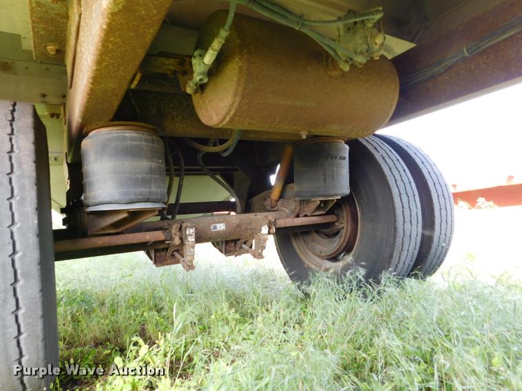 image for item DB1011 2000 Corn Husker triple hopper bottom grain trailer