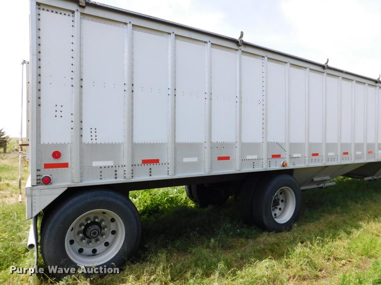 image for item DB1011 2000 Corn Husker triple hopper bottom grain trailer