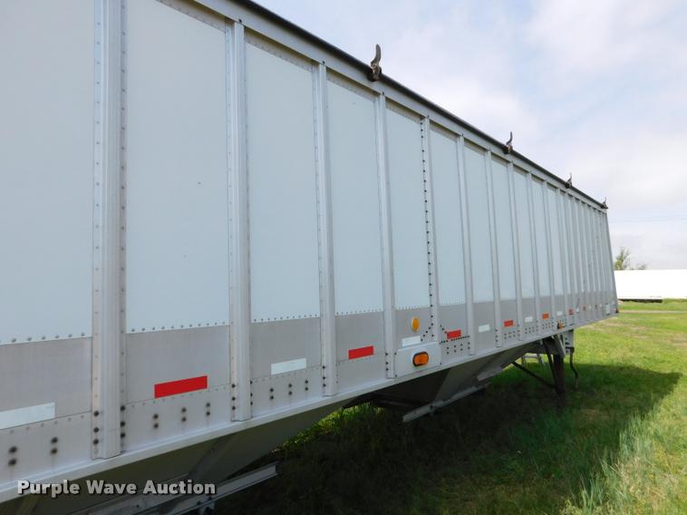 image for item DB1011 2000 Corn Husker triple hopper bottom grain trailer