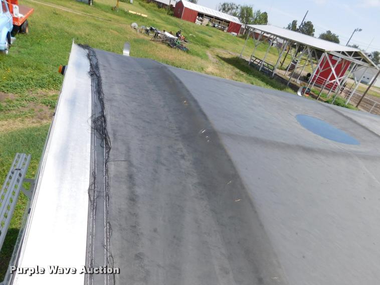 image for item DB1011 2000 Corn Husker triple hopper bottom grain trailer