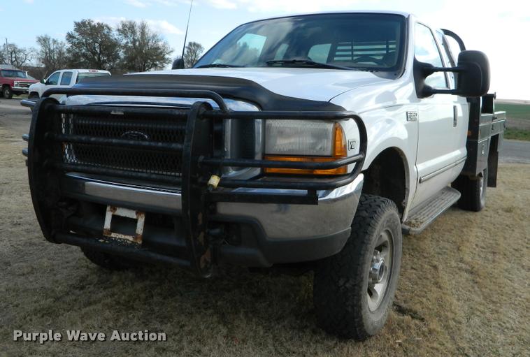 1999 Ford F350 Super Duty SuperCab bale bed pickup truck