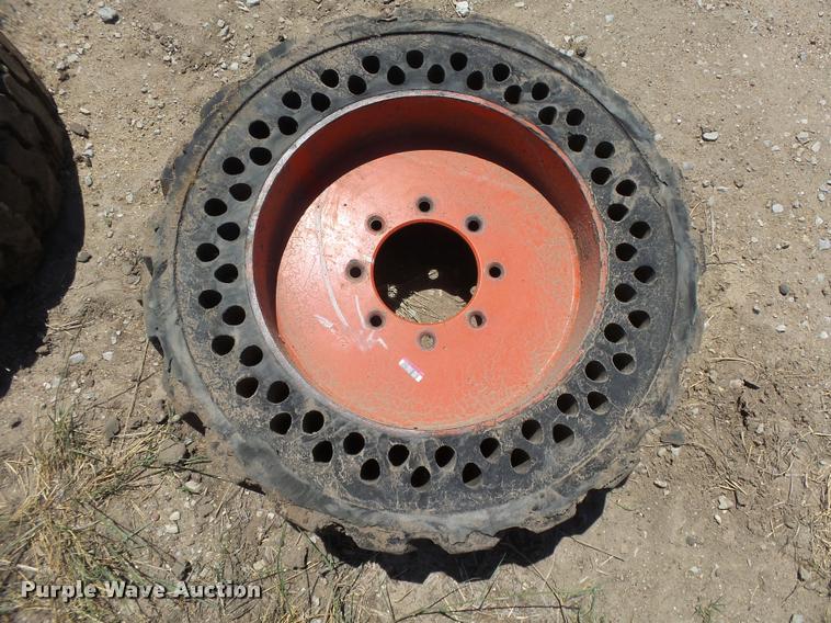 image for item DE9049 (4) 31x6x10/10-16.5 solid skid steer tires and wheels