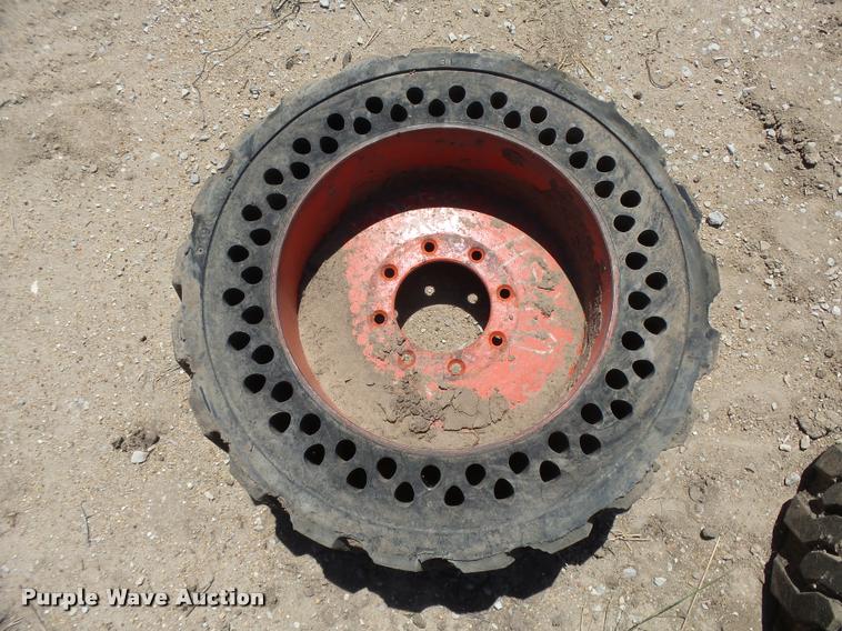 image for item DE9049 (4) 31x6x10/10-16.5 solid skid steer tires and wheels