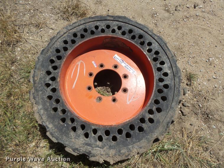 image for item DE9049 (4) 31x6x10/10-16.5 solid skid steer tires and wheels