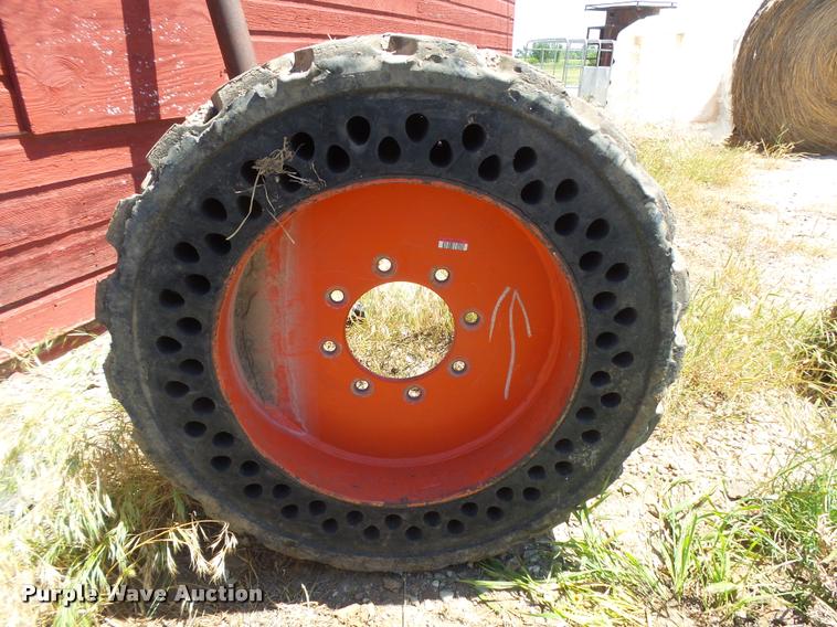 image for item DE9049 (4) 31x6x10/10-16.5 solid skid steer tires and wheels