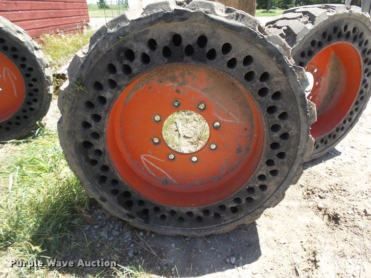 image for item DE9049 (4) 31x6x10/10-16.5 solid skid steer tires and wheels