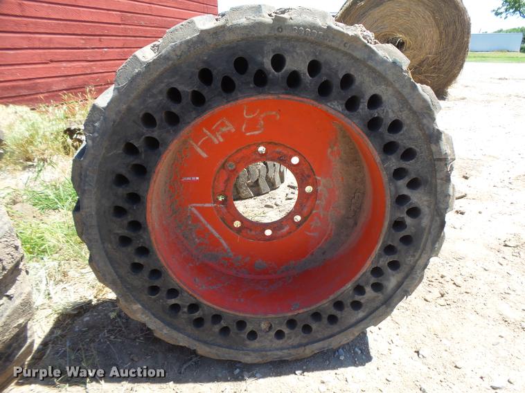 image for item DE9049 (4) 31x6x10/10-16.5 solid skid steer tires and wheels