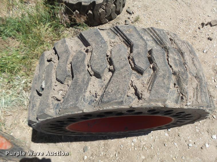 image for item DE9049 (4) 31x6x10/10-16.5 solid skid steer tires and wheels